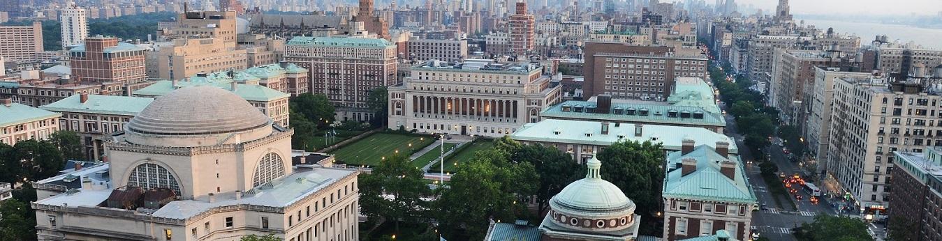 Aerial photo of Columbia's Morningside campus, looking over Low Library towards Butler Library and lower Manhattan