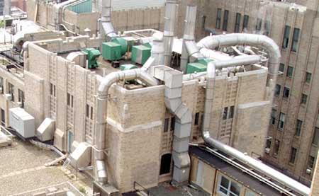 Rooftop image displaying smoke stacks.