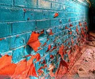 Brick wall picture showing peeling lead paint.
