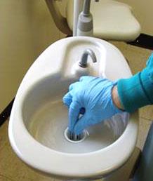 Figure 1 - Chairside traps being removed; traps are removed at least weekly by CDM Staff. Chairside traps being removed; traps are removed at least weekly by CDM Staff.