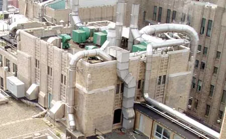 Rooftop image displaying smoke stacks.