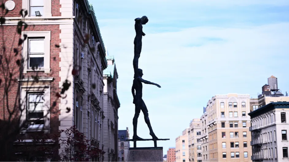 statue of tightrope walkers on Columbia's campus